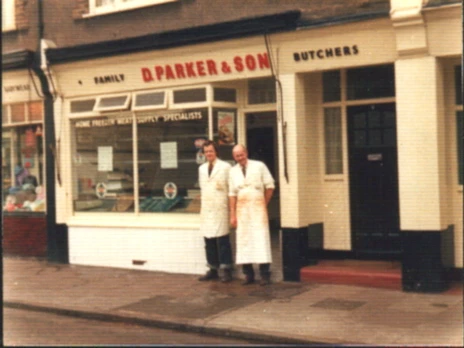 Derreck and Peter outside a more modern and extended shop.