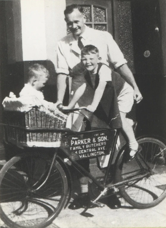 Derreck with his two sons Peter and Alan on a delivery bike.